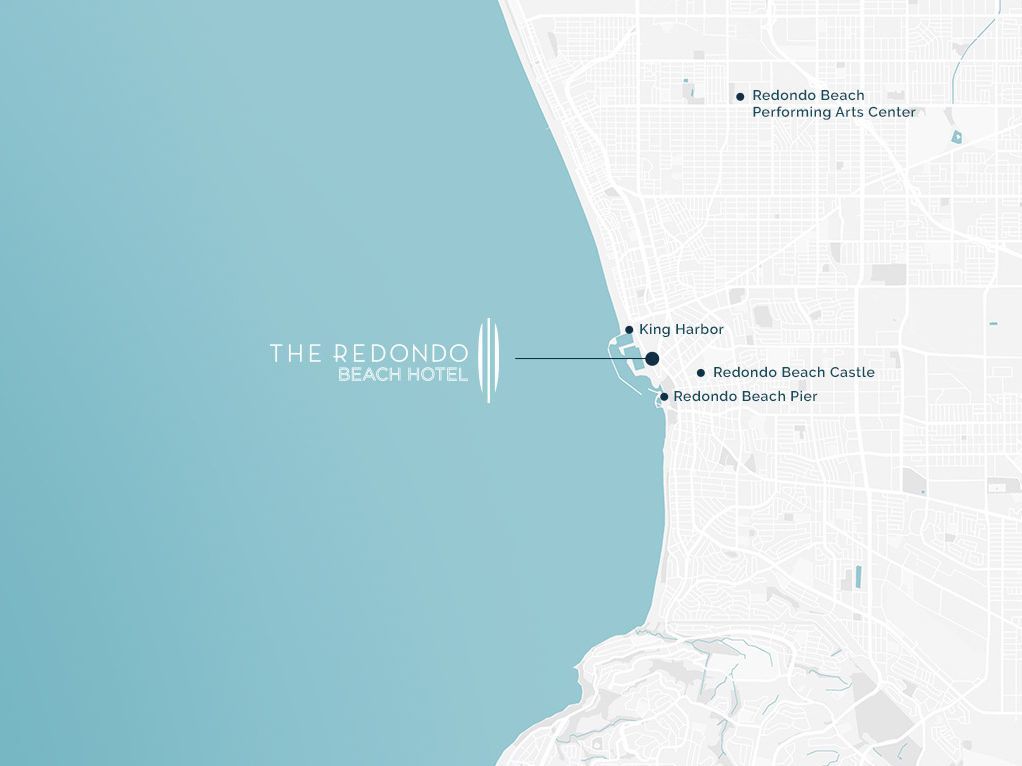 A map of a coastline with a blue ocean on the left and a light gray land area on the right, featuring a labeled marina or condominium near the water.